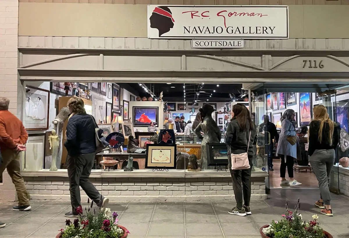 ArtWalk visitors outside the R.C. Gorman Navajo Gallery storefront at 7116 East Main Street.